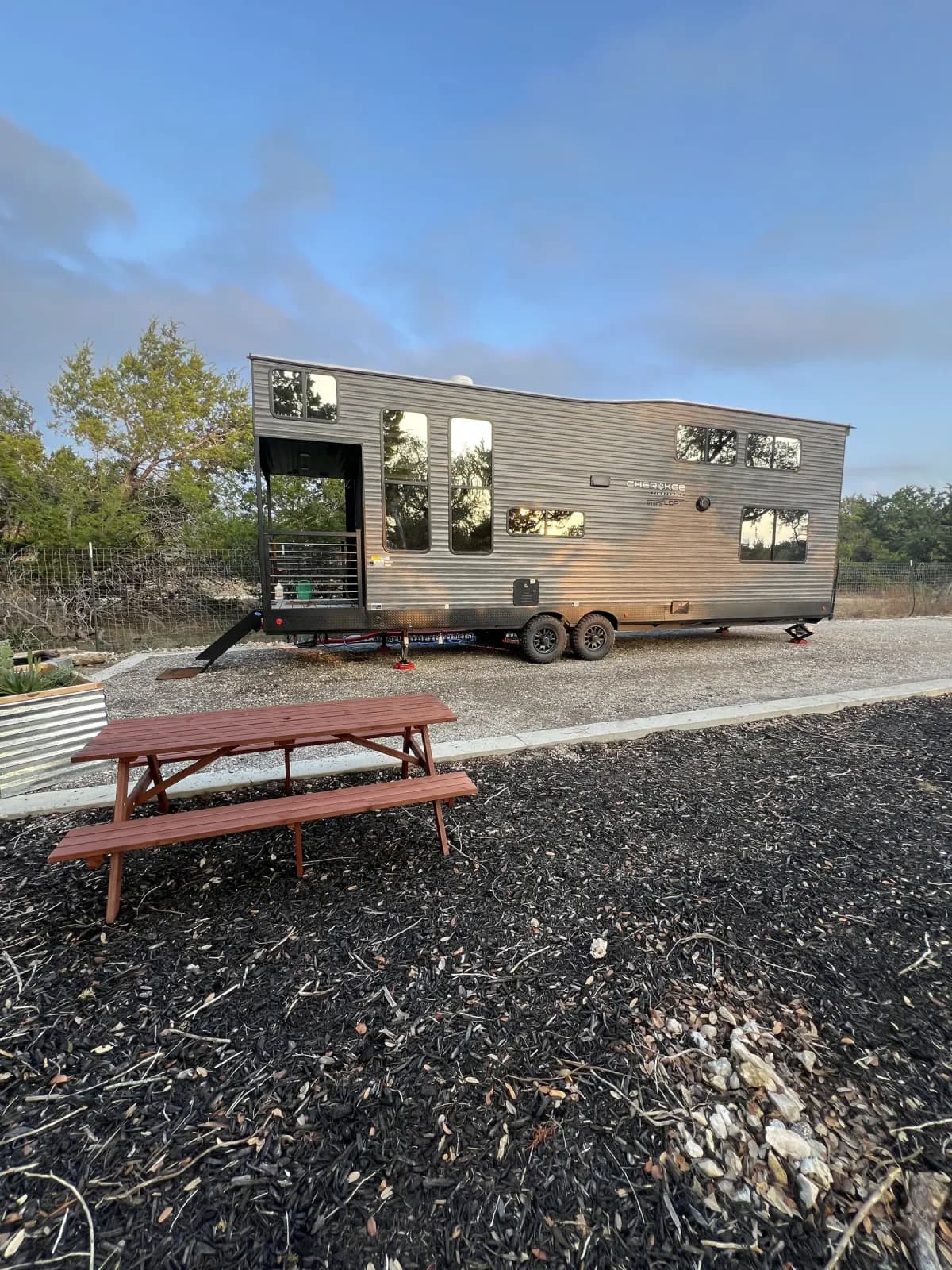 Blancobreeze exterior with picnic table on its gravel site