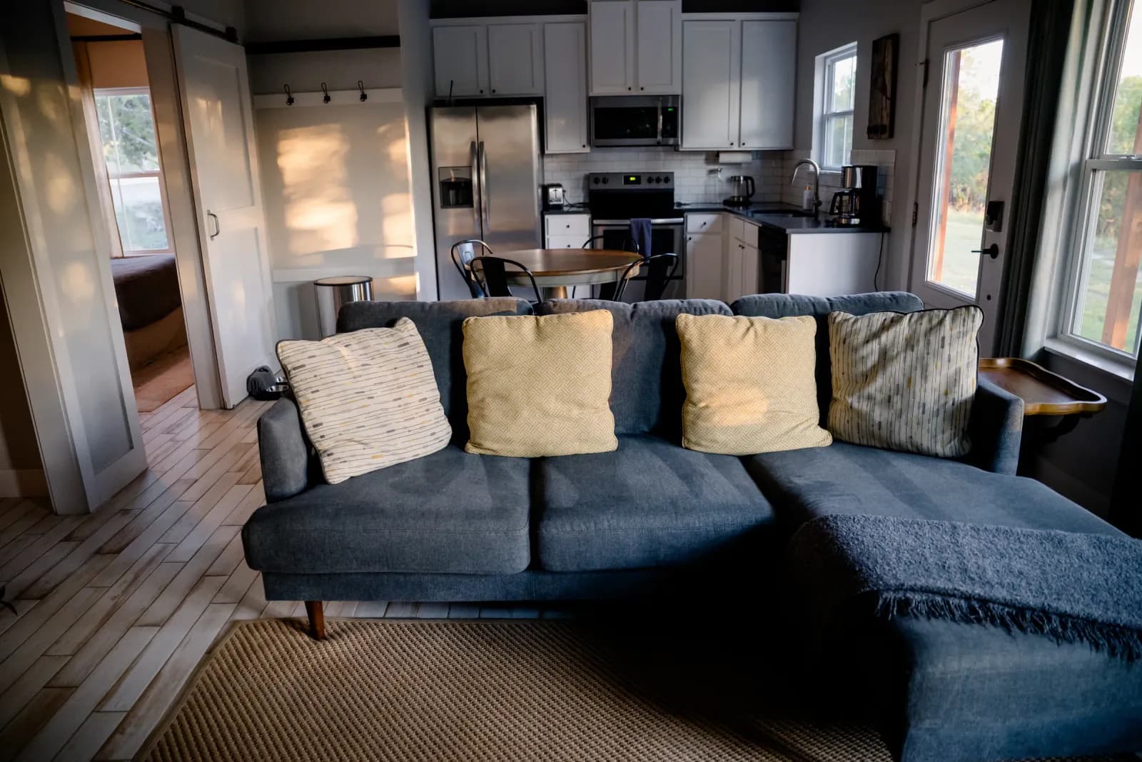 Open living room and kitchen inside a Wayside Wimberley farmhouse cottage