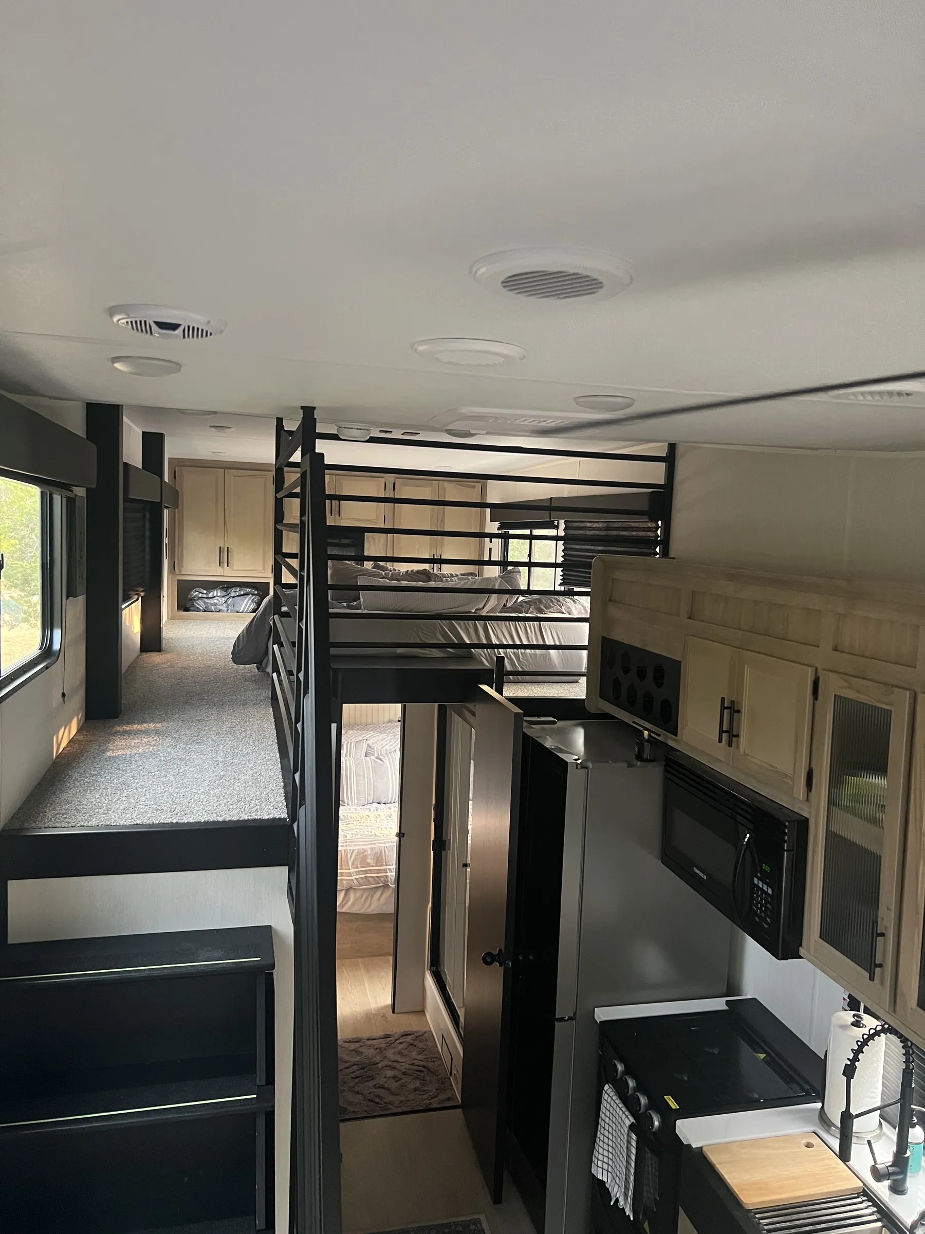 Loft bed above the kitchen inside Blancobreeze