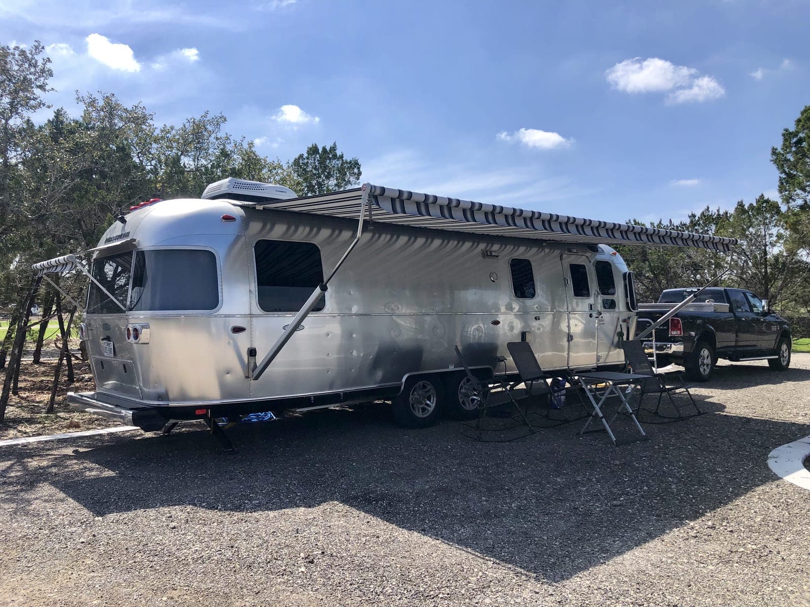 Classic vehicle and RV parked at Wayside Wimberley