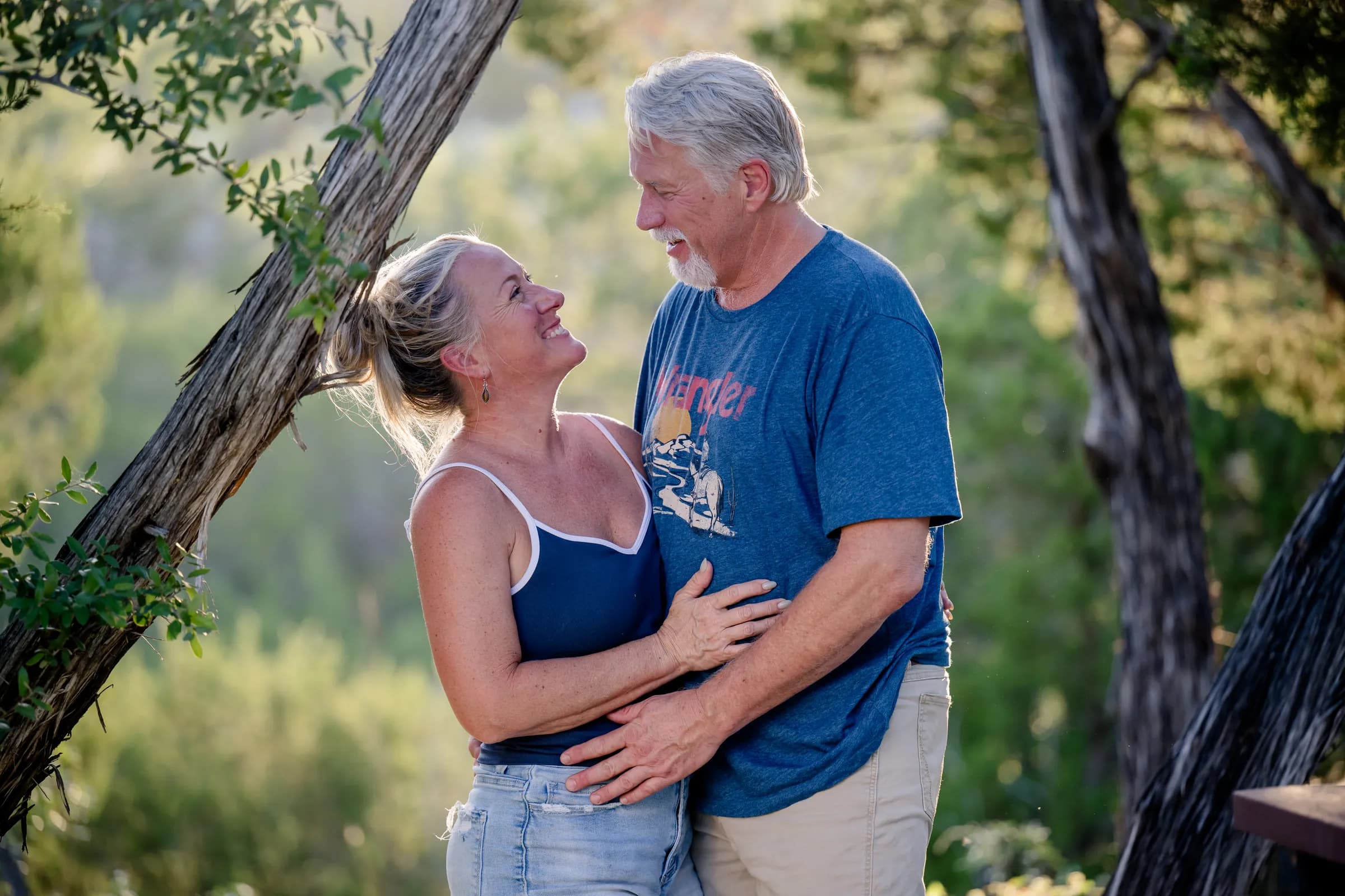 Stacey and David Wehmeyer under the oaks at golden hour at Wayside Wimberley