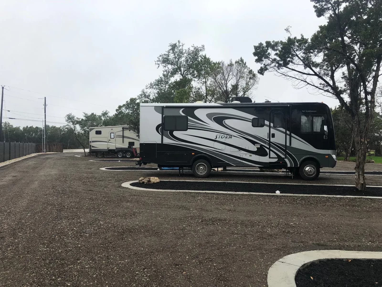 Travel trailer set up at a full hookup RV site in Wimberley TX