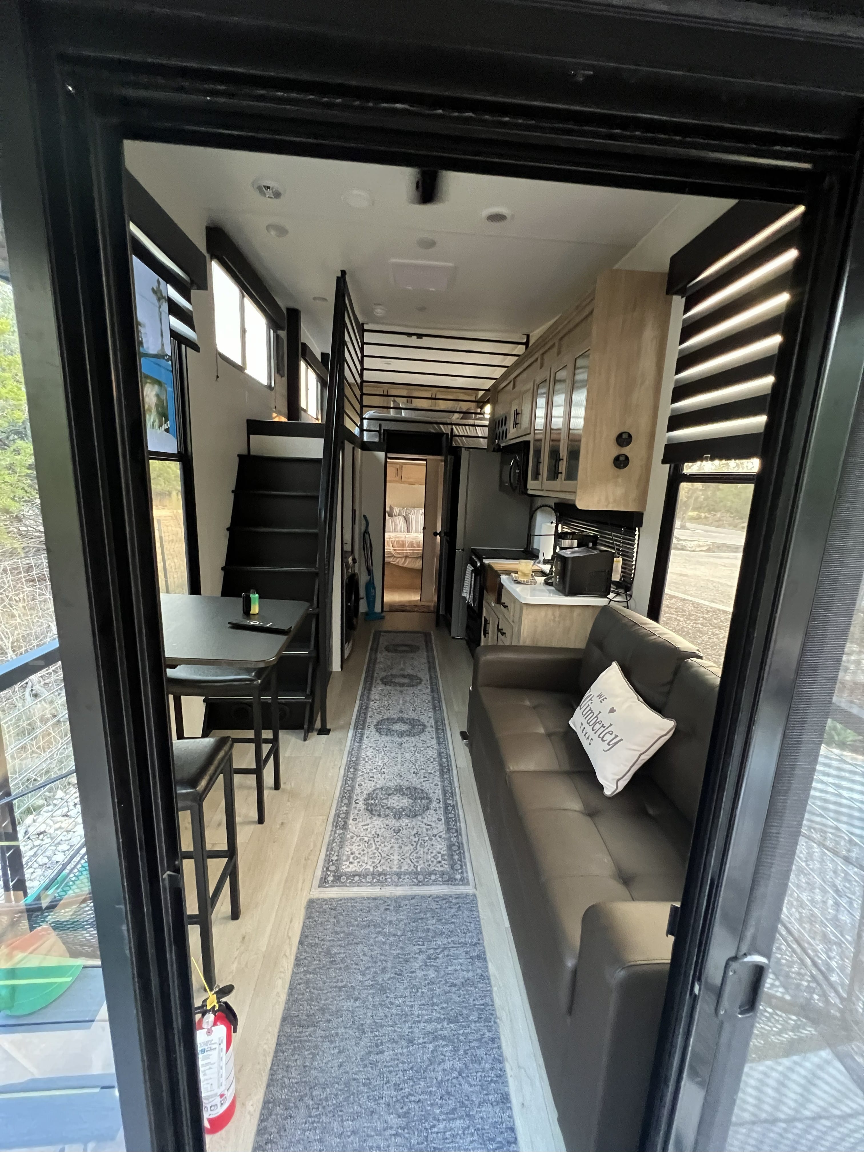 BlancoBreeze luxury glamping RV entry with glass door at Wayside Wimberley