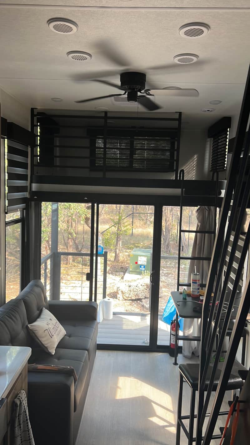 Interior of BlancoBreeze with loft bed and natural light