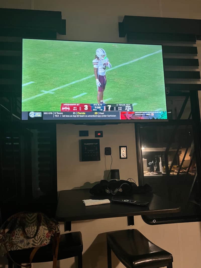 Smart TV and workspace inside BlancoBreeze glamping RV