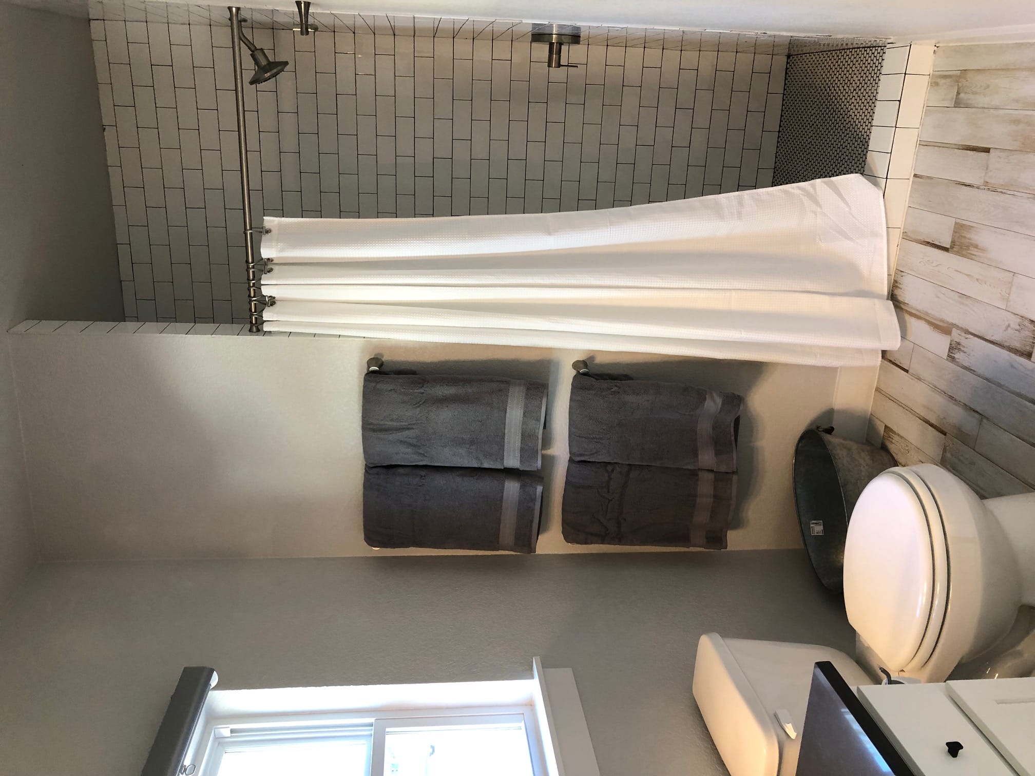 Farmhouse bathroom with subway tile in Summermoon Cottage