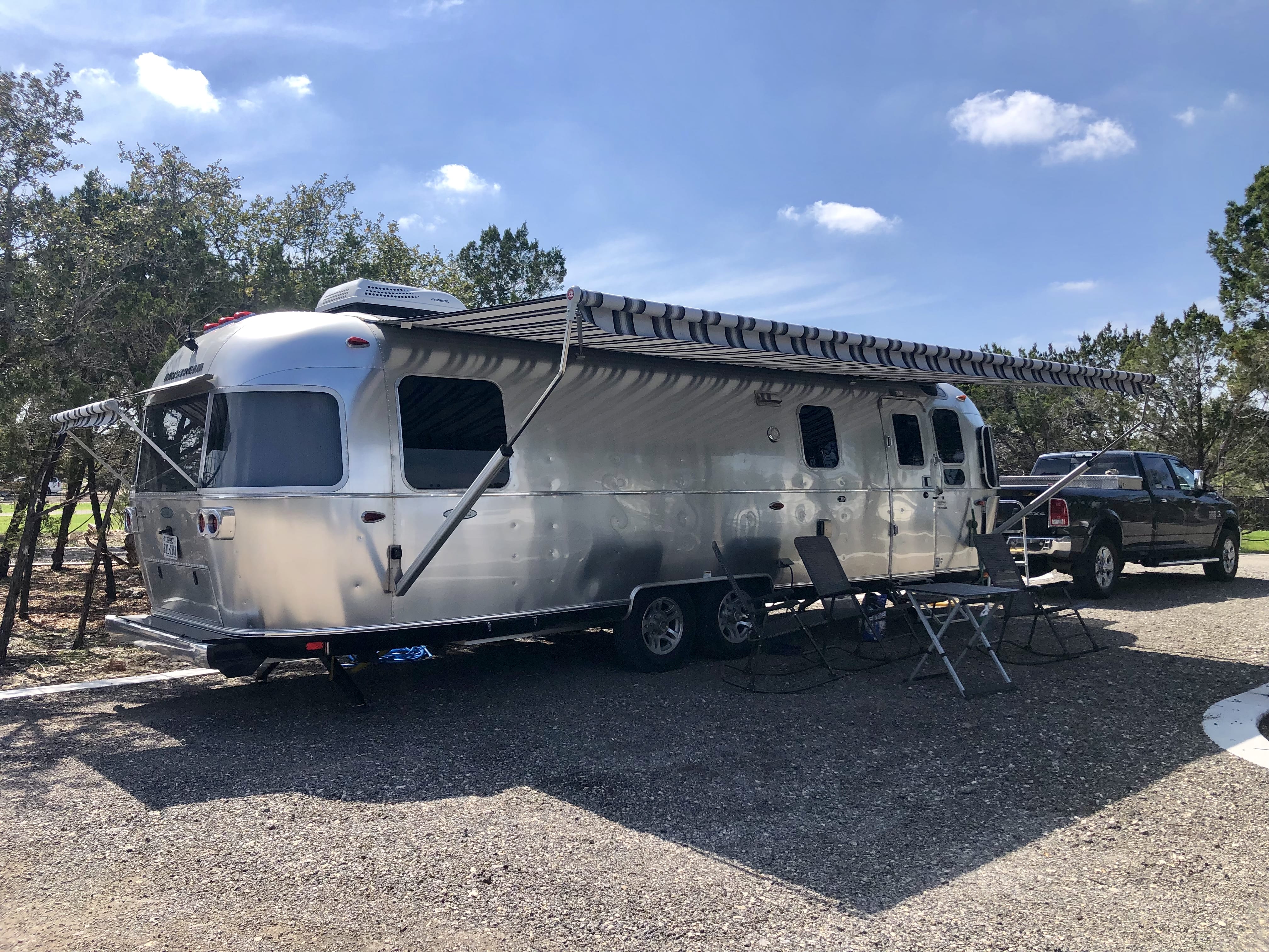Classic vehicle and RV parked at Wayside Wimberley